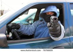 You'll Love The Police For Giving A Woman A Ticket For 2 MPH Under The Limit-stock-photo-assassin-shooting-from-a-moving-car-76798609.jpg