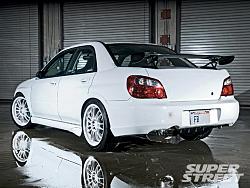 my other car was in SUPERSTREET last month ..(PIX)-130_0901_25_z-2005_subaru_wrx_sti-rear_quarter_view.jpg