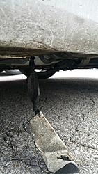 Piece of car hanging under car-20170125_094042.jpg
