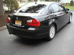 2006 BMW 325i sedan, 6-speed, Black/Black-3passrear.jpg