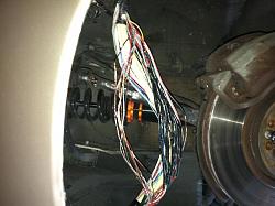 Shredded the insulation off of the wiring harness in the driver side wheel well-image.jpg