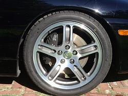 Who has stock wheels from another car on their SC? Post a pic.-frontwheel.jpg