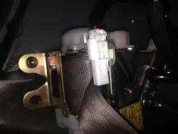 Can anyone tell me what these plugs in the seat belts do?-img_5383.jpg