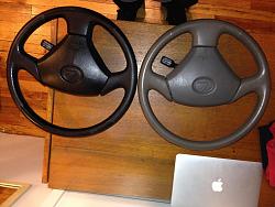 Three PERFECT Steering Wheels. 2 Three Spoke, One Black, One Tan. 1 Four Spoke ,Black-both.jpg