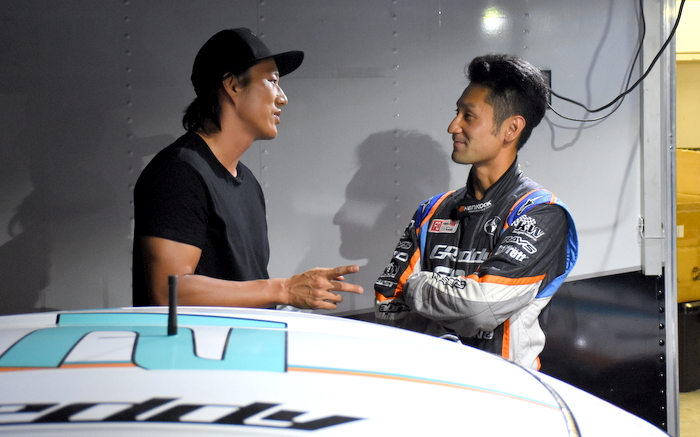 Sung Kang and Ken Gushi talking shop.
