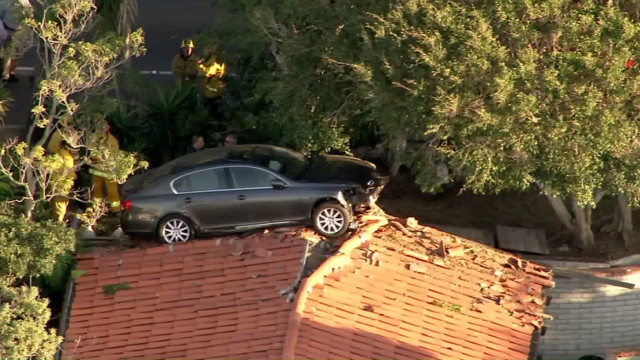 Lexus Driver Loses Control, Ends Up on Someone’s Roof