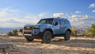 Blue 2024 Toyota Land Cruiser on dirt road